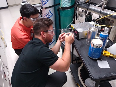 CJ and
                            Jared fix mass flow controller at CNMS lab